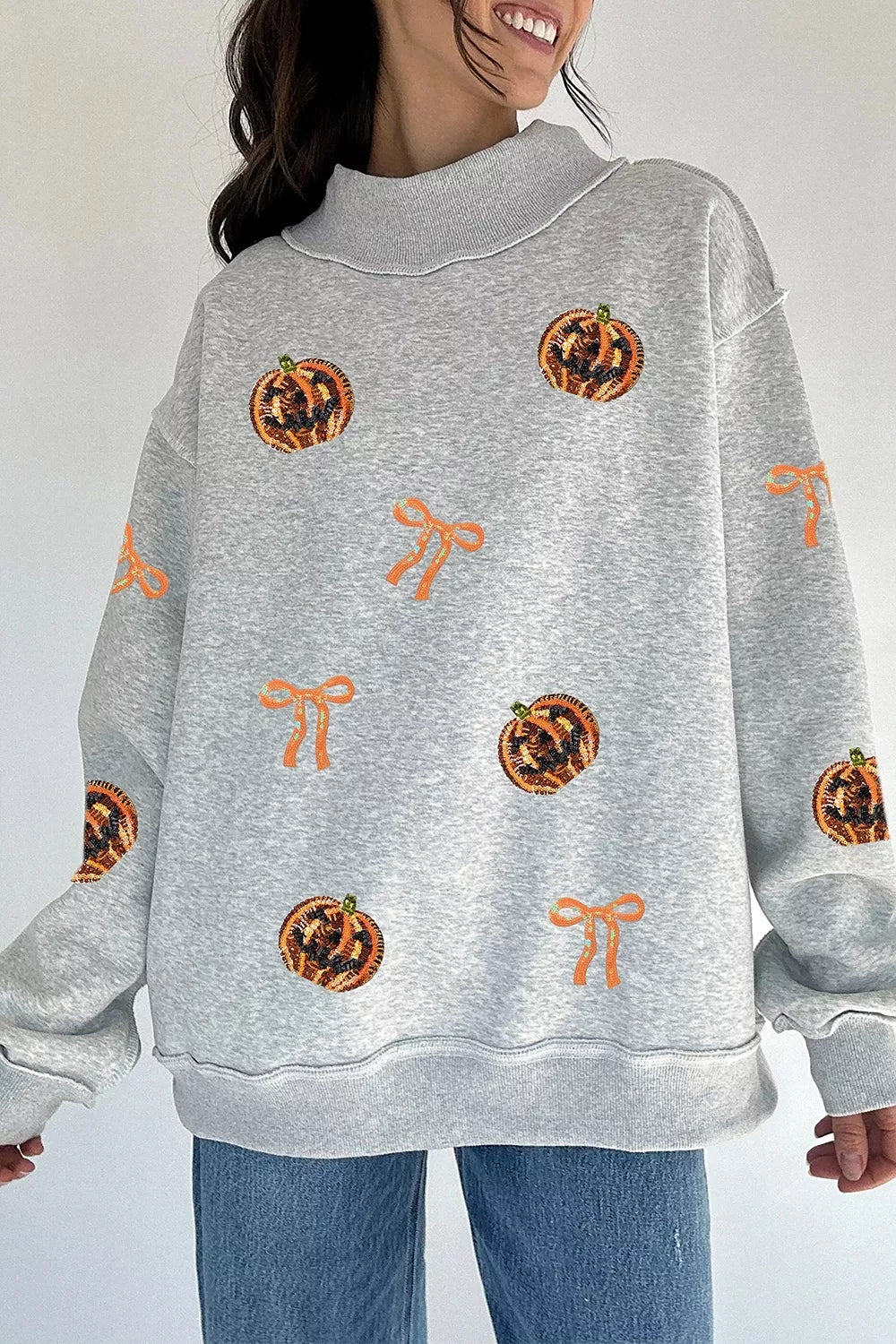 SYNZ Sequin Pumpkin Face Bow Exposed Seam Halloween Sweatshirt